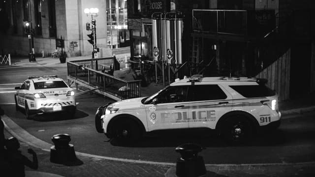 Thumbnail of a recorded clip: two police cars on a street at night